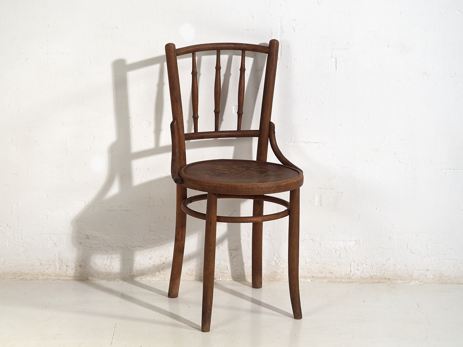 Antique Parisian cafe style wooden chairs (c.1920)