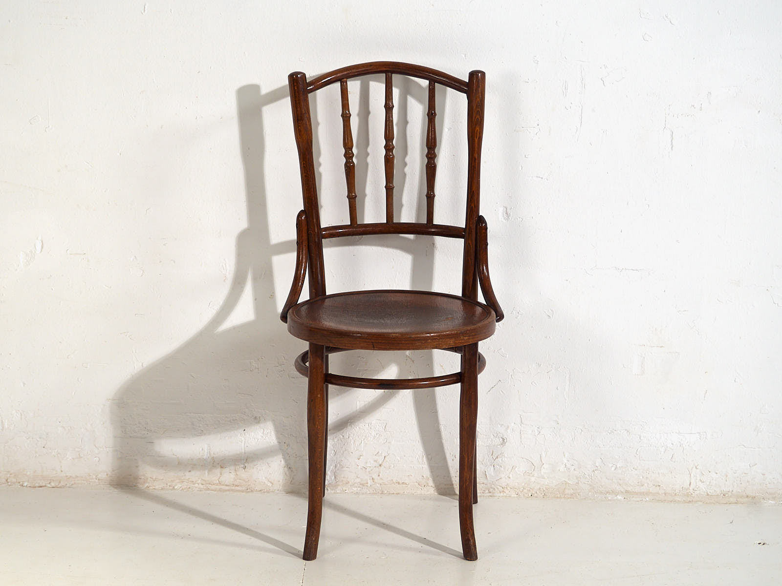Antique Parisian cafe style wooden chairs (c.1920)